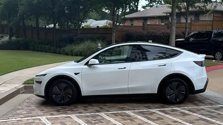 2026 Tesla Model Y Premium in Pearl White Multi-Coat — side profile